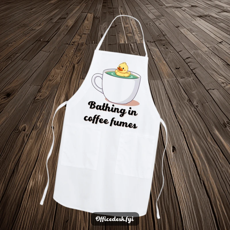 Funny apron featuring a tiny character with a rubber ducky floating happily in a giant coffee mug, perfect for a humorous cook.
