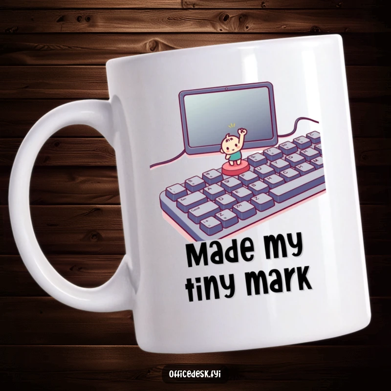 Funny mug with a small character triumphantly pressing a tiny button on a large keyboard, symbolizing a big win.