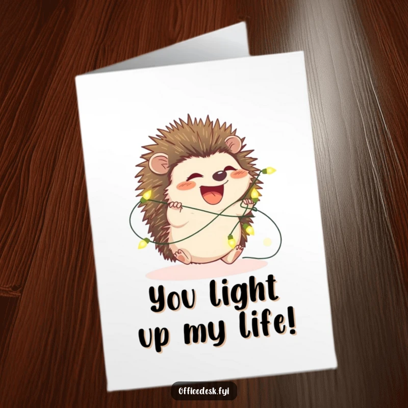Funny Free Printable Birthday Card: A cute hedgehog is adorably tangled in glowing fairy lights, looking both festive and confused.
