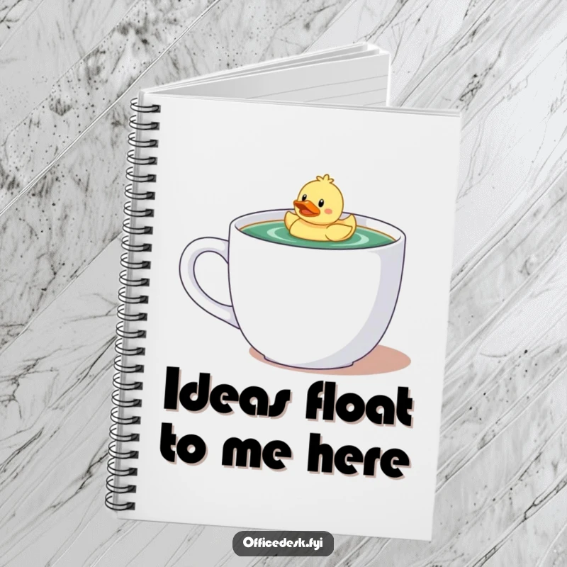 Funny notebook with a tiny character and rubber ducky enjoying a bath in a large coffee mug, inspiring creative writing.