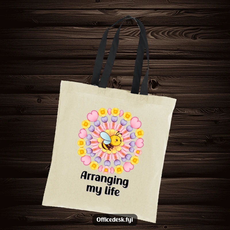 Funny tote bag featuring a busy bee arranging flower petals in a perfect geometric pattern, symbolizing artistic planning and creative purpose.