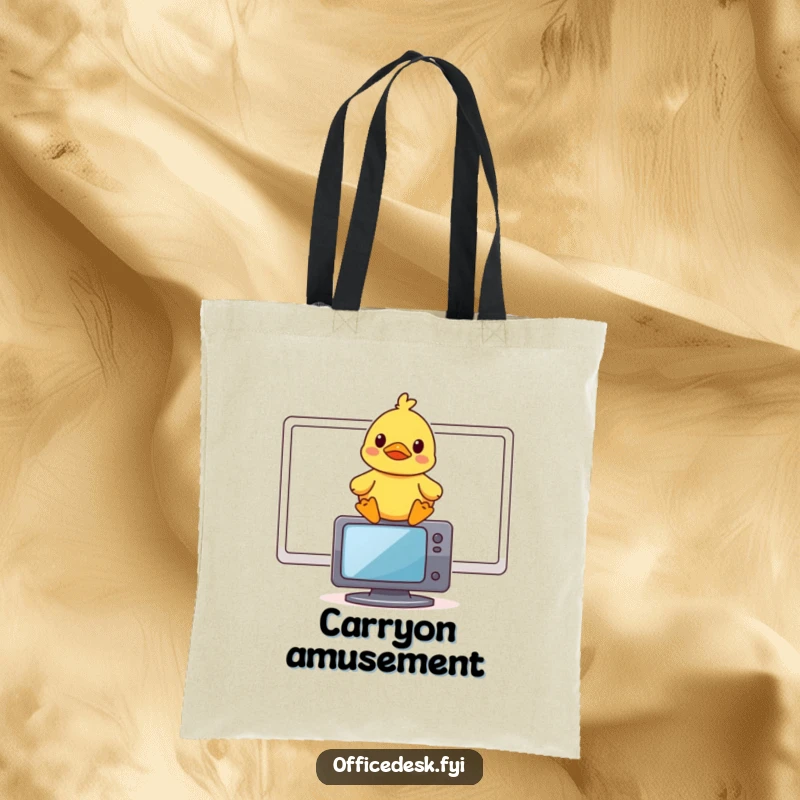 Funny tote bag with a small rubber duck sitting atop a computer monitor, looking amused.